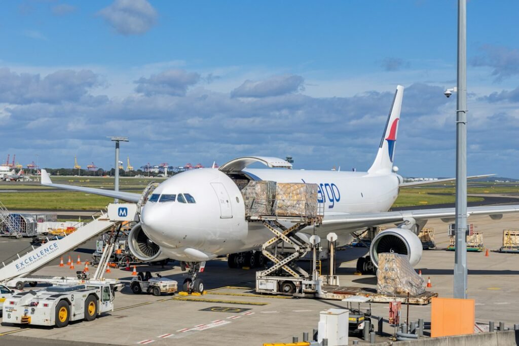 Cargo aircraft being unloaded for international air freight logistics